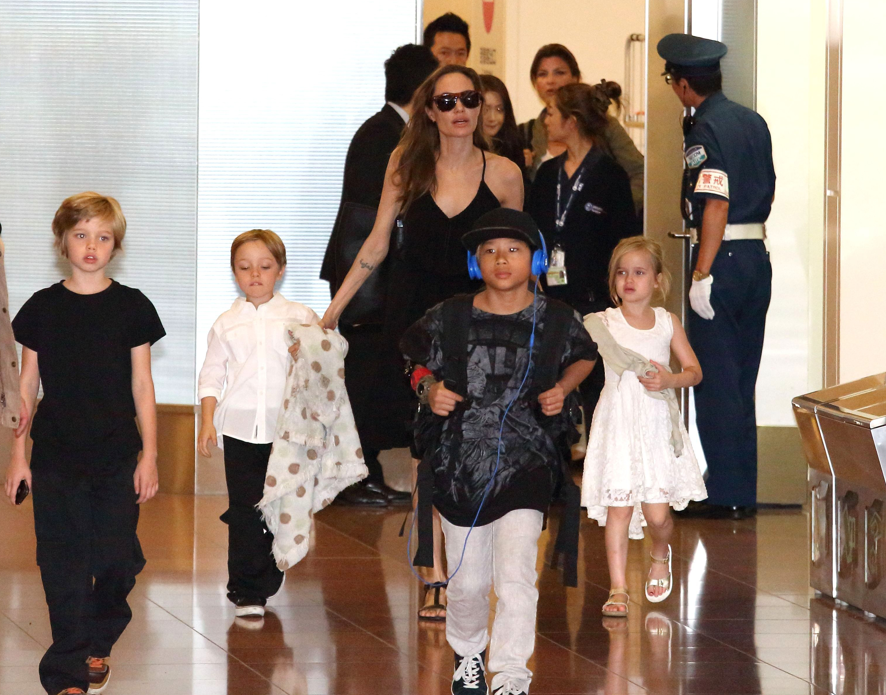 Mandatory Credit: Photo by Masatoshi Okauchi/REX/Shutterstock (3854763a) Angelina Jolie and children Shiloh Jolie-Pitt, Knox Jolie-Pitt, Pax Jolie-Pitt and Vivienne Jolie-Pitt Angelina Jolie and family at Haneda International airport, Tokyo, Japan - 21 Jun 2014 Angelina Jolie and family arrives in Japan to attend the Japanese premiere of the movie 'Maleficent', which will be released on July 5th